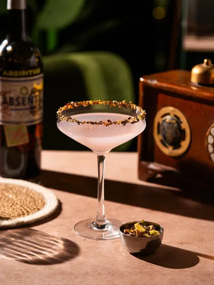 An absinthe cocktail with a beautifully garnished rim. The details matter, and I focus on capturing the craftsmanship that goes into each drink.