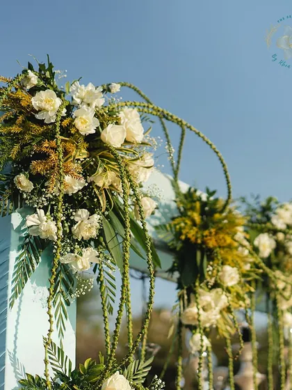 A detailed shot of the floral decor, showing the intricate arrangement of white flowers and unique greenery.