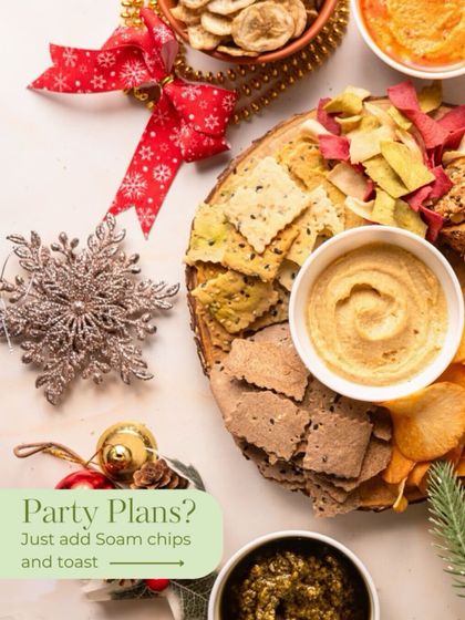 Party plans? Just add my chips and toast. This festive platter showcases my artisanal crackers and veggie chips with various dips, making your holiday spread effortlessly elegant.
