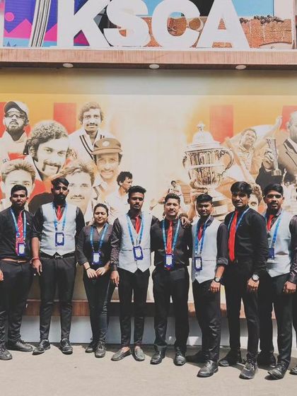 Our full bartending crew posing at the Karnataka State Cricket Association (KSCA) stadium. Teamwork is the secret to our success in managing bar services for large scale cricket matches.