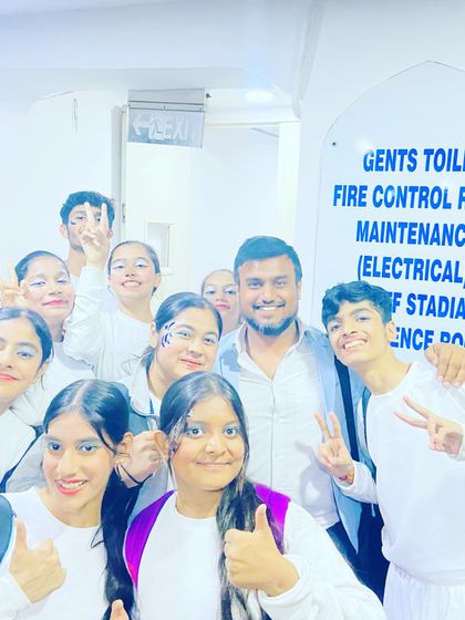 A happy selfie with a group of students backstage. The energy and excitement of school events are contagious.