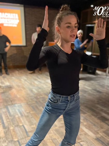 International artist Jessica demonstrating a move during the Salsa and Bachata workshop.