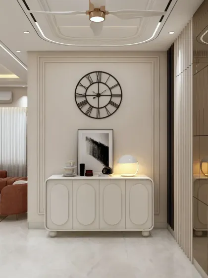 A minimalist console table set against a paneled wall with a large clock. The reflection in the mirrored wall beside it adds depth and a sense of spaciousness.