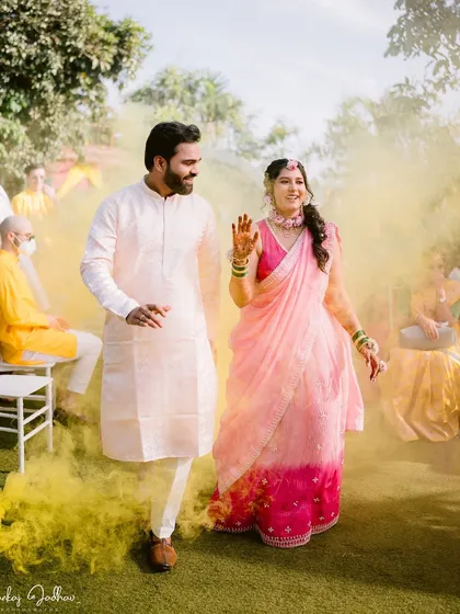 Making an entrance in a cloud of yellow smoke. Ankita and Shantanu's Haldi entry was full of energy and color.