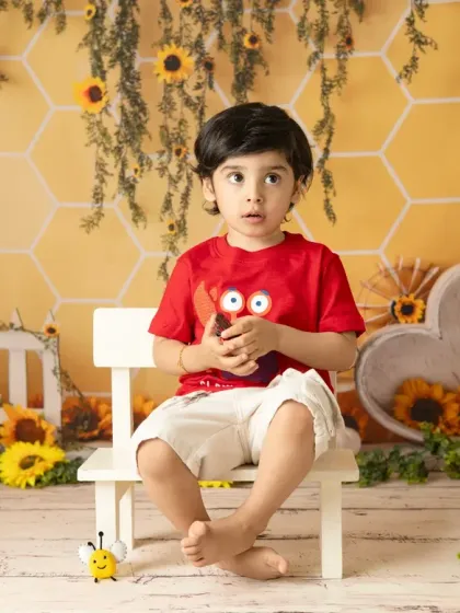 A little boy's bright personality shines in this cheerful sunflower-themed photoshoot, creating sunny and happy portraits.