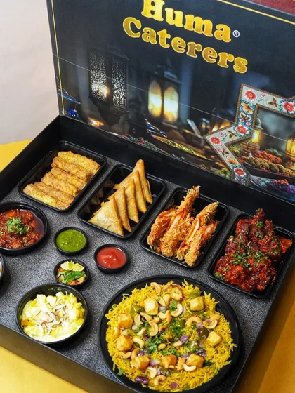 A fully packed Iftaar Box, showcasing a complete meal from pulao and starters to chutneys and dessert. It's a hassle-free feast.