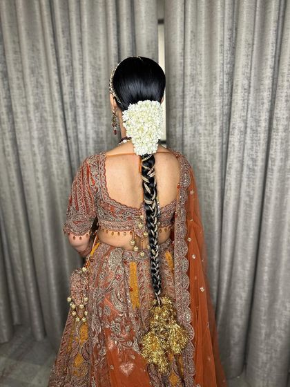 Another view of the stunning bridal braid, showcasing its length and rich ornamentation.