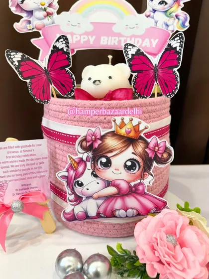 Another angle of our unicorn and princess hamper, showing the personalized thank you card on a mini easel.