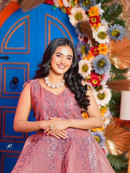 A full view of the lovely pink gown and the happy, confident client.