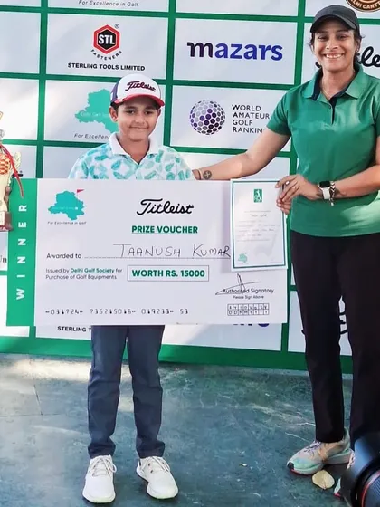 Taanush Kumar receives his winner's prize at the NCR Cup 17th Junior & Amateur Golf Tournament.