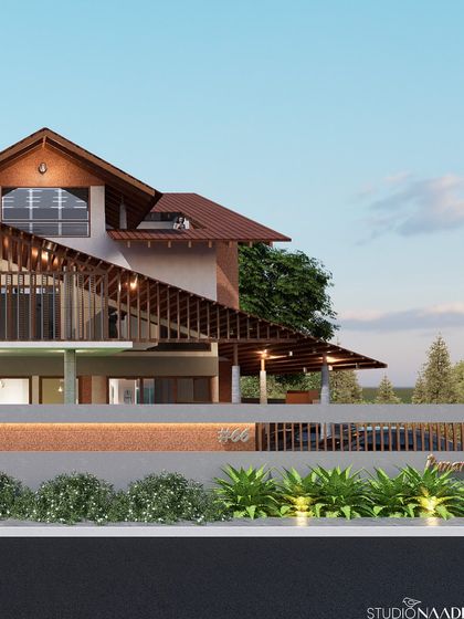 This design showcases a complex, angular roof structure that provides extensive shading for the floors below. The use of vertical wooden slats and a low-profile boundary wall creates a modern yet warm aesthetic that is well-suited to its environment.