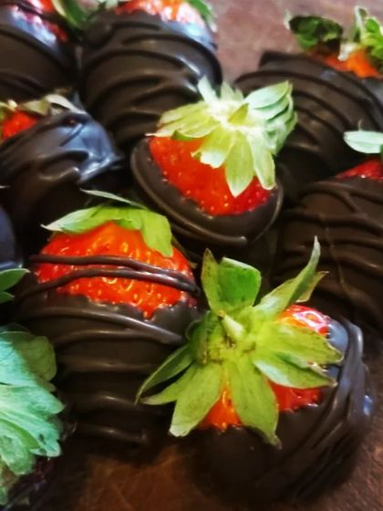 A classic romantic treat, these are our Chocolate Dipped Strawberries. Fresh, juicy strawberries are dipped in rich dark chocolate, making for a simple yet elegant dessert.