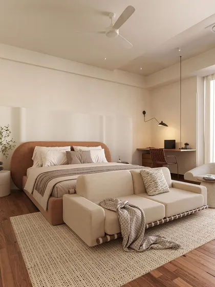 This bedroom is a study in soft minimalism and functionality. The curved, upholstered bed frame adds a gentle softness, while the integrated sofa at the foot of the bed and a dedicated work desk make it a versatile, multi-purpose sanctuary.