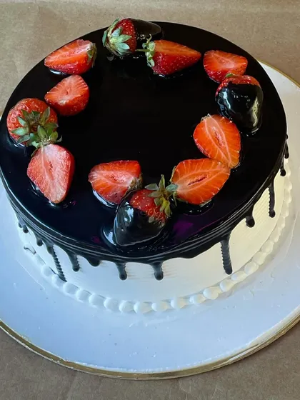 A delightful fusion of rich chocolate and fresh strawberries. This cake combines a dark chocolate glaze with juicy, ripe strawberries for a perfect balance of flavors.