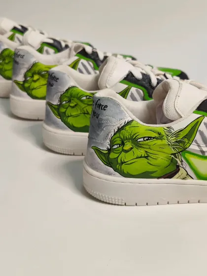 A lineup of the Yoda shoes. Even though they are part of a limited run, each hand-painted shoe has its own unique character.