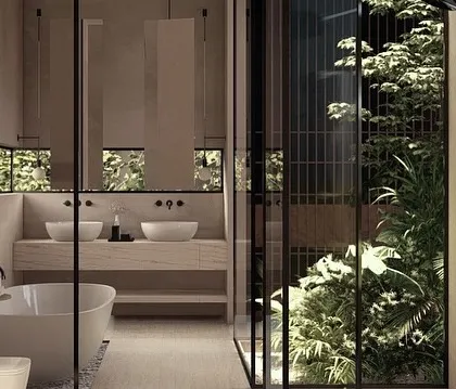 In our Moira homes, private spaces like this bathroom become sanctuaries. We use flowing curves, soft light filtered through inner courtyards, and a direct connection to lush greenery to create a feeling of warm serenity and tropical escape.