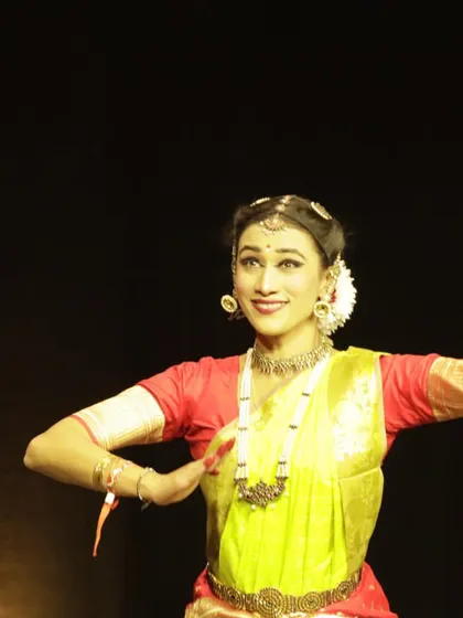 A photo from my performance in Paris for an event honoring Prime Minister Shri Narendra Modi. The joyful expression and open posture convey a sense of pride and celebration.