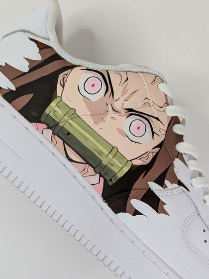 A close-up on the Nezuko side of the crossover AF1s. I focused on capturing her intense expression from the show, complete with her iconic bamboo muzzle.