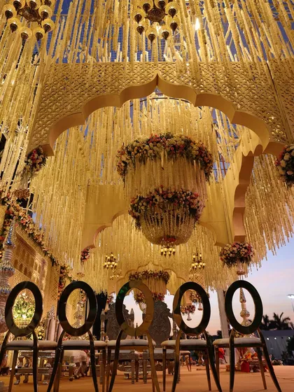 Another view of our work in Rajkot, this time at sunset. The magnificent floral canopy and arched structure create a truly breathtaking silhouette against the evening sky.