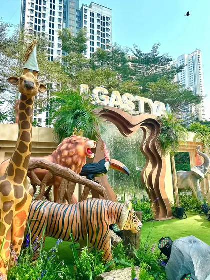 For this 'Wild Two' jungle themed birthday, we created a massive custom stage with marquee letters, a waterfall feature, and life-sized animal props to serve as the perfect backdrop for the celebration.