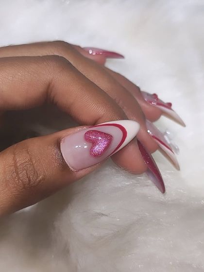 A close-up of the cherry and heart set, focusing on the glittery pink heart accent nail.