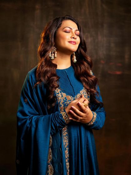 A serene and soulful portrait of Priyanka Barve, capturing her deep connection to music during our photoshoot.