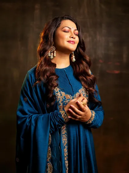 A serene, eyes-closed shot that captures a moment of musical bliss.