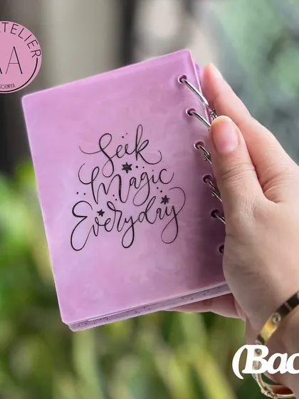 A personalized resin notebook with the inspiring quote "Seek Magic Everyday." This was another custom item included in a thoughtful Rakshabandhan hamper for a sister.