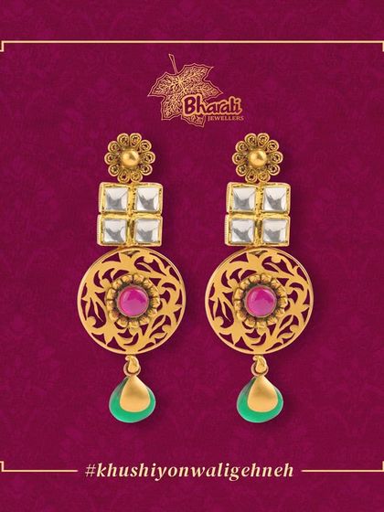 Add a touch of elegance to your look with these long, dangling earrings. The design combines traditional Kundan and intricate Jali work with colorful Meenakari drops for a vibrant, minimalist statement.