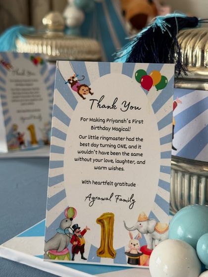 A close-up of the personalized thank you card from the Agarwal family, a thoughtful detail included in the first birthday favors.