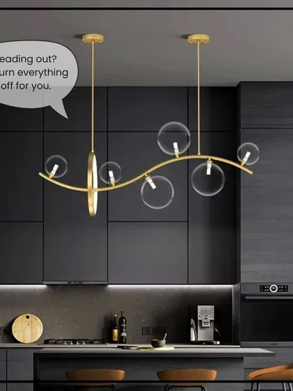 Heading out? Your smart home can turn everything off for you, as shown in this modern, dark-themed kitchen.
