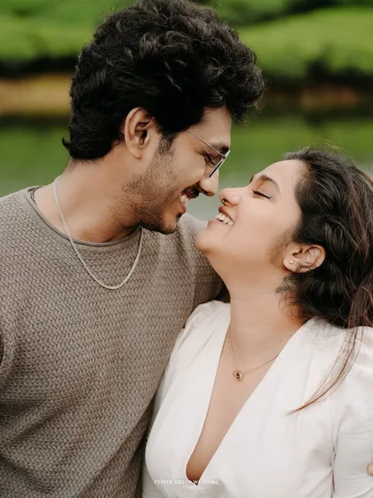 A close-up portrait capturing the happy, intimate connection between the couple during their pre-wedding shoot in the hills.