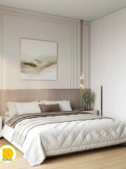 A close-up of the bed with its elegant headboard and classic wall molding. The design is timeless and luxurious.