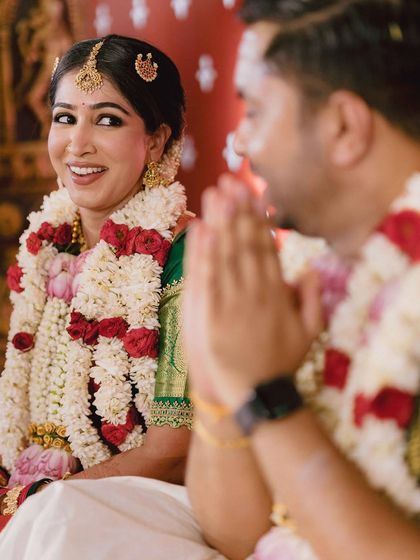 The bride's candid, happy glance towards her groom during their ceremony. It's these small, unscripted looks that tell the real story of their love and excitement.