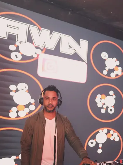 It's not just about playing music; it's about putting on a show. Here I am in my element, with custom VJ graphics lighting up the stage, making sure the visual energy matches the audio.