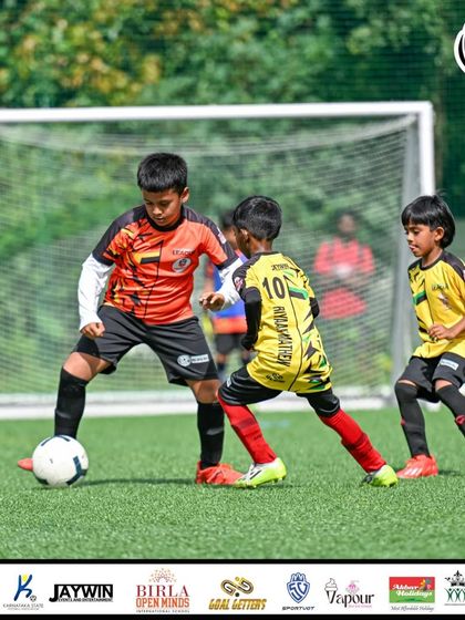A young attacker looks to get past a defender. These one-on-one situations are crucial moments in any match.