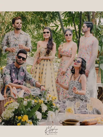 We love styling for the entire wedding party to create a cohesive, beautiful story. For this sun-drenched picnic theme, we curated a palette of florals and pastels, ensuring each person's outfit complemented the others while still reflecting their individual style. This is how we create picture-perfect family moments.