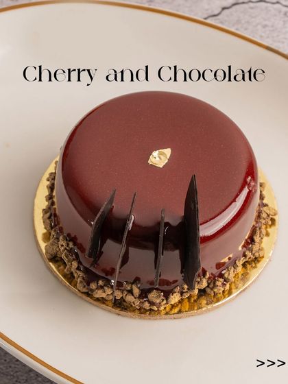 My Cherry and Chocolate pastry, a small entremet with a glossy red glaze. The combination of sweet cherry and rich chocolate is a timeless classic.