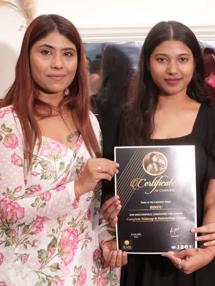 Bindu, holding her certificate of completion. So excited to see what she does next.
