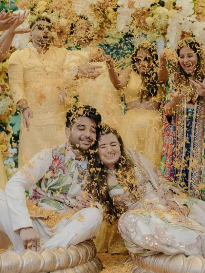 Pure, unscripted joy during a Haldi ceremony. We love capturing the candid fun and laughter as friends and family shower the couple with flower petals, creating memories filled with energy and color.