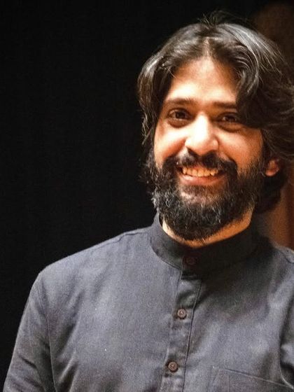 A warm portrait of one of our singer-composers. The smiles of our artists reflect the joy we find in creating and sharing our work.