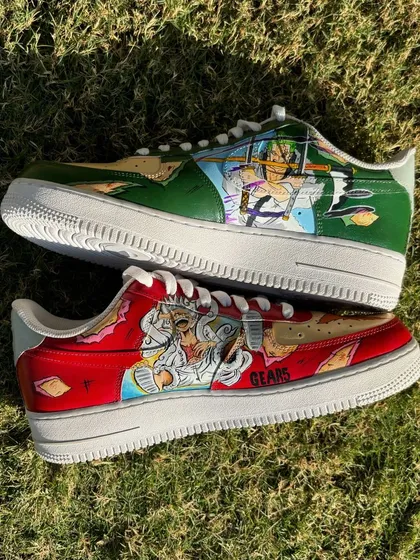 A top-down view of the custom One Piece sneakers, showing the contrast between the two powerful characters.