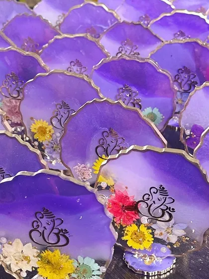 This is my favorite sight, a whole family of mini Ganesha favors ready to go to their new home. I made this batch of 150 pieces in a beautiful custom purple, each with a Ganesha motif, real dried flowers, and a gold-painted edge. They are perfect as wedding return gifts or mehendi favors. 🌸
