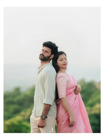 A quiet, contemplative pose against the backdrop of the hills. This showcases a different, more serene side of their connection.