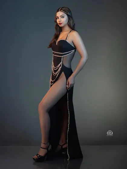 A perfect example of a clean, high-impact studio portrait. I used controlled lighting to sculpt the model's form, emphasizing the lines of the black gown and the strength of the pose. This is the kind of sharp, modern fashion shot I specialize in.