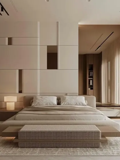 A minimalist bedroom with a low-profile bed and a striking geometric accent wall. The neutral color palette and clean lines create a sense of calm and sophistication.