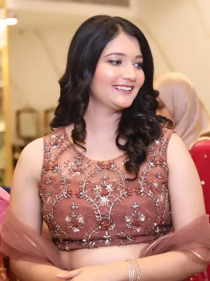 A candid shot showing her beautiful smile and the natural-looking glam makeup.