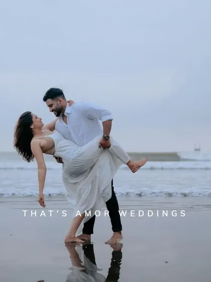 A dynamic pose on the beach, with the ocean in the background. This shot combines classic romance with a sense of movement and style.