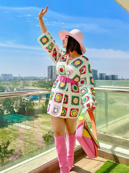 A happy, celebratory pose in my colorful crochet look. This is what dopamine dressing is all about.
