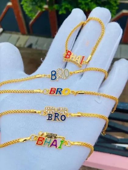 For the brother who loves a bit of fun and style. This collection of "BHAI" and "BRO" rakhis comes in colorful enamel with stone accents on a sturdy gold-plated chain.